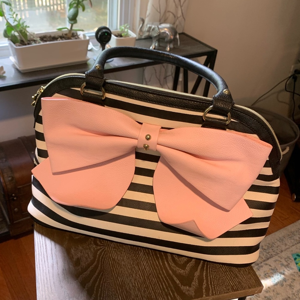 Betsey Johnson striped handbag with large light pink bow.